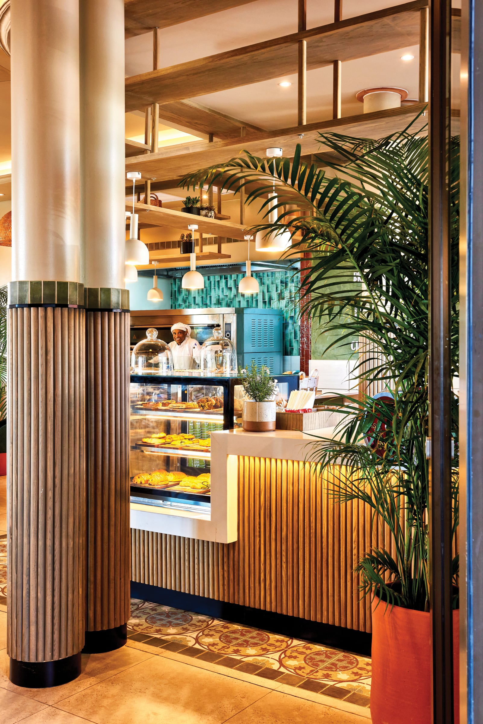 Inside the Walmer bakery, warm wood and greenery