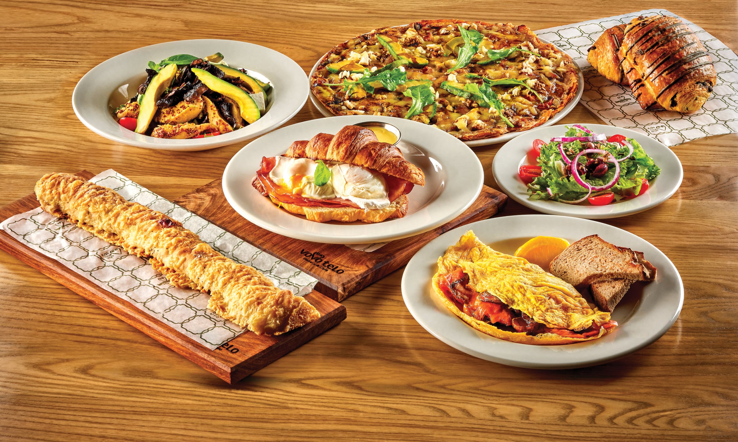 A spread of Vovo Telo dishes on a wooden table